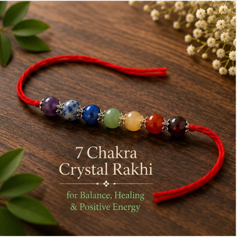 7 Chakra Crystal Rakhi with Amethyst, Lapis Lazuli and Citrine beside festive diya – Bellarosa Gems