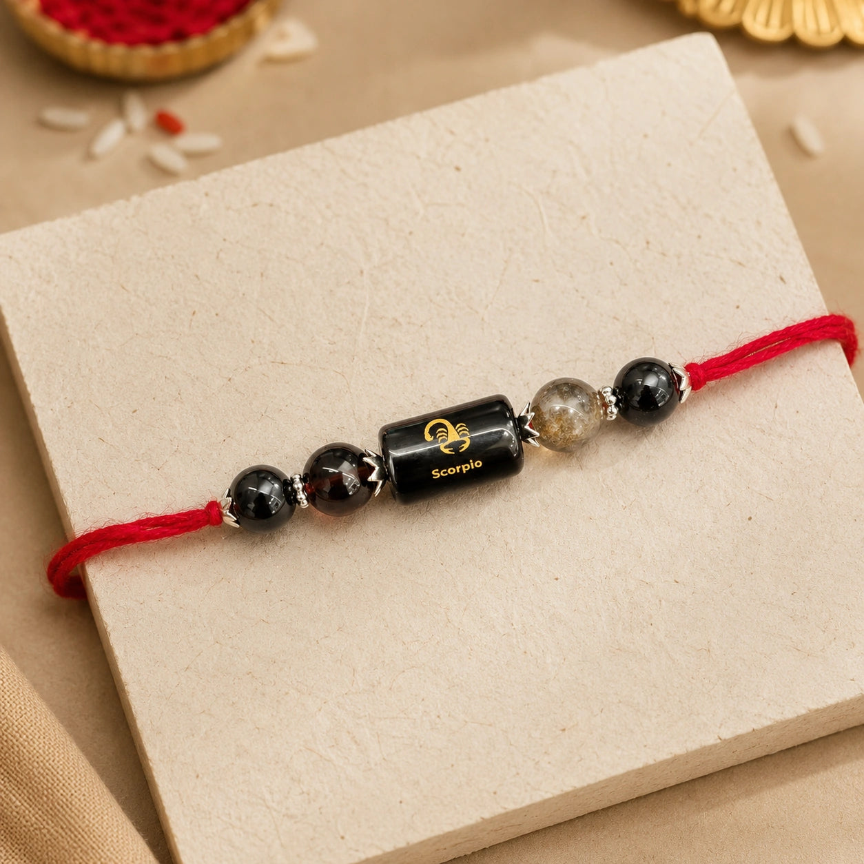 Vrishchik Rashi Scorpio Crystal Rakhi with Black Tourmaline, Black Obsidian and Smoky Quartz – natural certified crystal rakhi by Bellarosa Gems