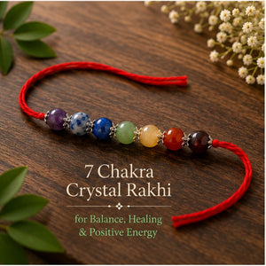 7 Chakra Crystal Rakhi with Amethyst, Lapis Lazuli and Citrine beside festive diya – Bellarosa Gems