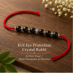 Evil Eye Crystal Rakhi with Black Tourmaline and Obsidian beside festive diya – Bellarosa Gems