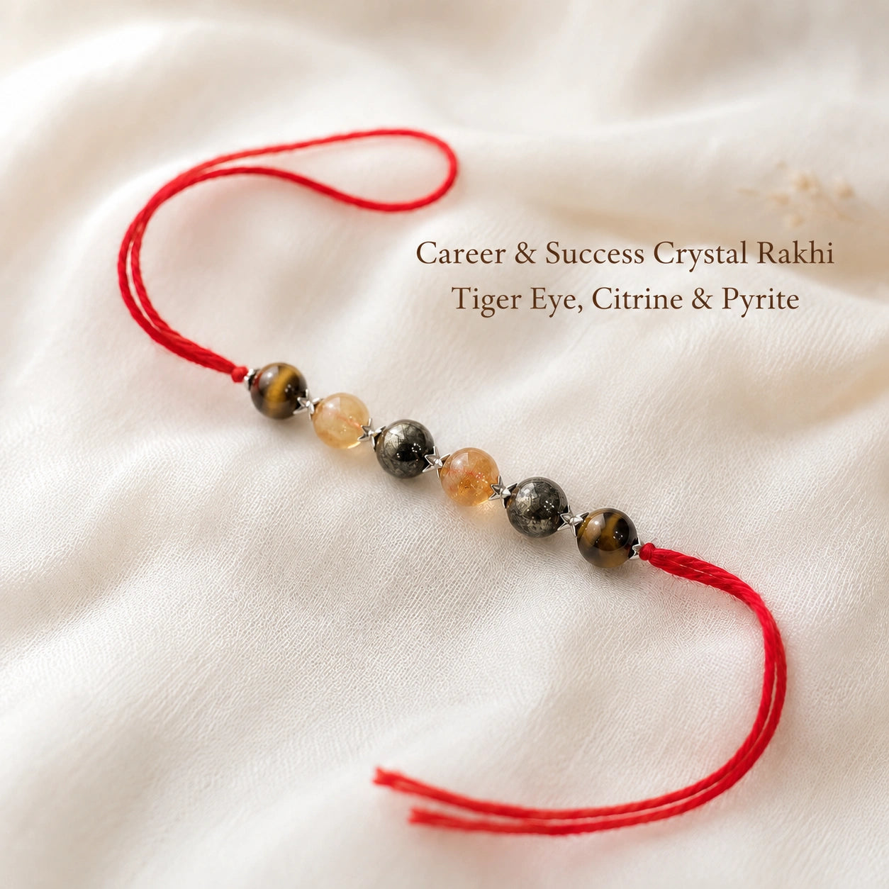 Career & Success Crystal Rakhi with Tiger Eye and Citrine beside festive diya – Bellarosa Gems