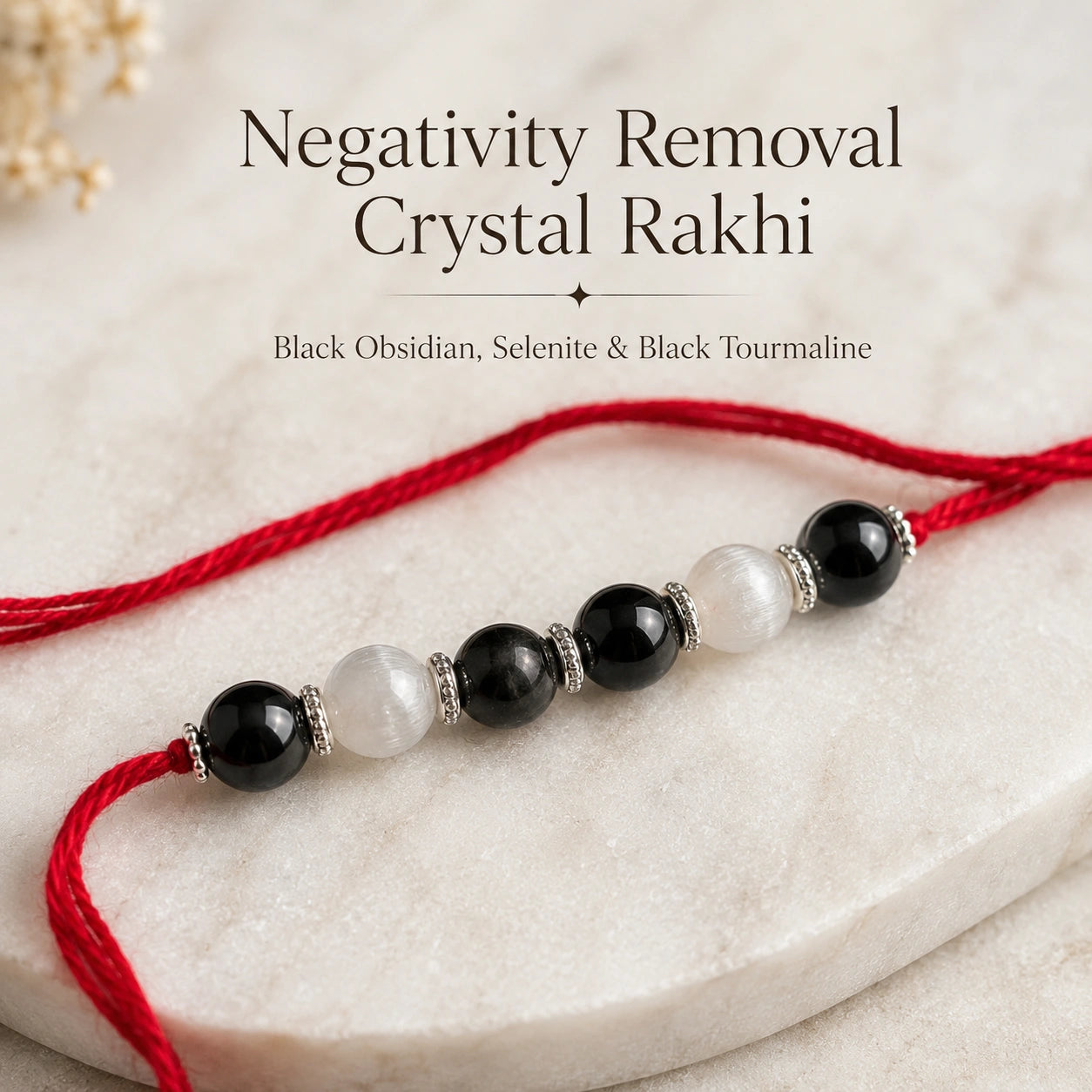 Negativity Removal Crystal Rakhi with Black Obsidian beside festive diya – Bellarosa Gems