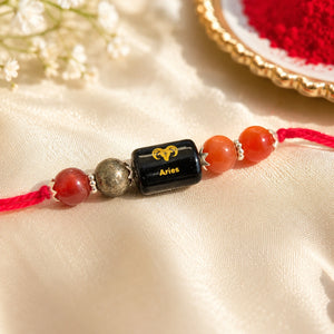 Mesh Rashi Aries Crystal Rakhi with Carnelian, Red Jasper and Pyrite – natural certified crystal rakhi by Bellarosa Gems